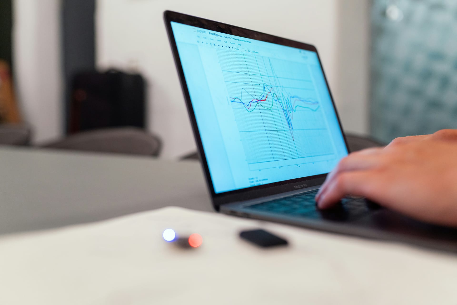 Person at laptop with data analysis workflow